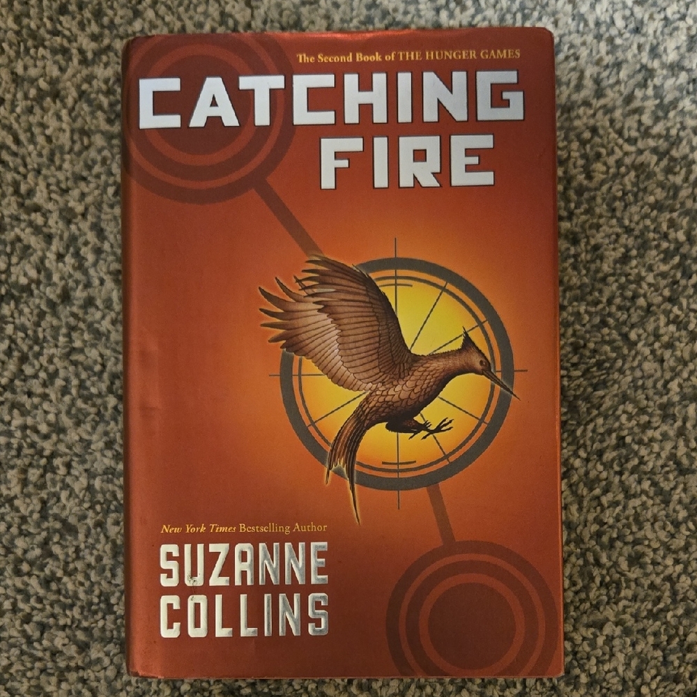 Catching Fire by - Orange and Brown Book